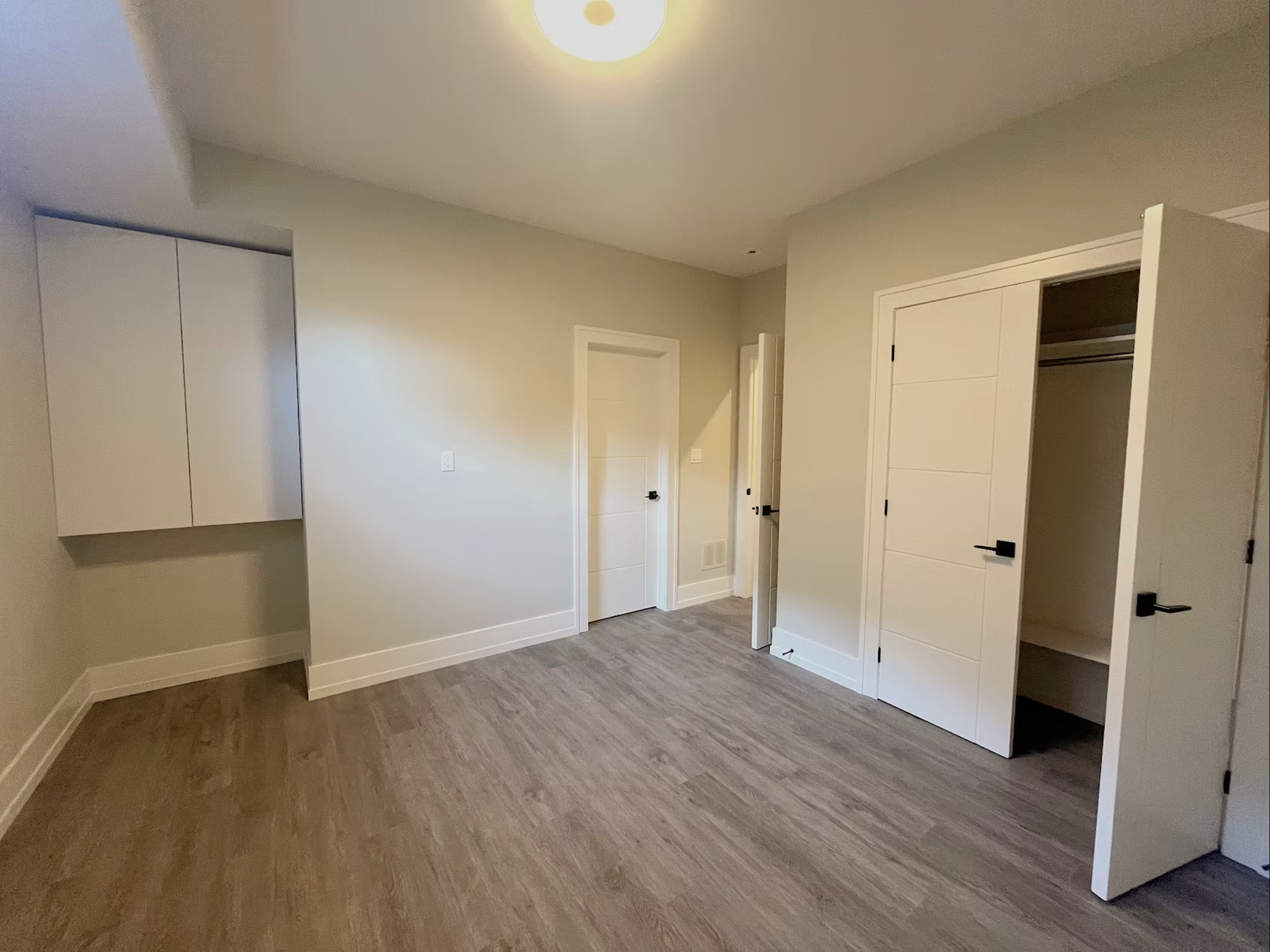 Finished basement interior — smooth drywall and trim